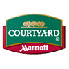 Courtyard by Marriott logo with green, red, and gold colors and three trees above the brand name.